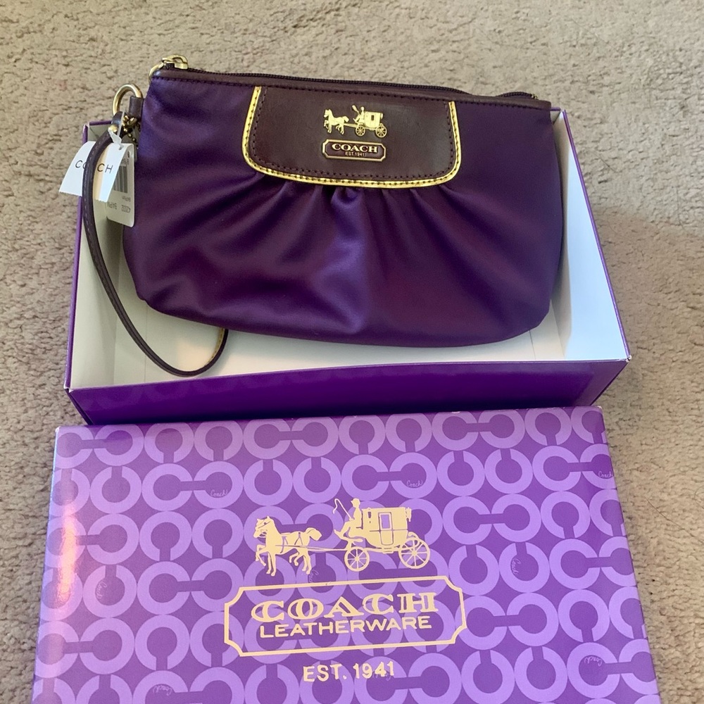 NWT purple satin Coach clutch.